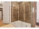 Contemporary shower features tiled walls, glass enclosure, and access to a custom closet at 2233 Peachtree Ne Rd # 1207, Atlanta, GA 30309