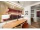 Home office with spacious desk, modern art, and ample lighting at 2233 Peachtree Ne Rd # 1207, Atlanta, GA 30309