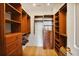 Walk-in closet with custom wood shelving and drawers for storage at 2233 Peachtree Ne Rd # 1207, Atlanta, GA 30309