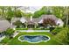 An aerial shot of a home with a beautifully landscaped yard and custom kidney shaped pool at 3489 Knollwood Nw Dr, Atlanta, GA 30305