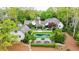 Expansive aerial view showcasing the home's lush backyard, kidney-shaped pool, and meticulously landscaped grounds at 3489 Knollwood Nw Dr, Atlanta, GA 30305