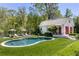 Backyard featuring a pool, lounge chairs, and detached building at 3489 Knollwood Nw Dr, Atlanta, GA 30305
