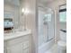 Bathroom with marble vanity and shower with glass sliding doors at 3489 Knollwood Nw Dr, Atlanta, GA 30305