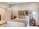 Bedroom featuring unique mirror over bed, neutral tones, and side table decor at 3489 Knollwood Nw Dr, Atlanta, GA 30305
