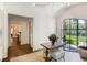 Entryway with a table, large window view of the yard, and access to other rooms at 3489 Knollwood Nw Dr, Atlanta, GA 30305