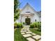 Charming home entrance with a stone pathway, beautiful door and manicured landscaping at 3489 Knollwood Nw Dr, Atlanta, GA 30305