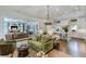 Open floor plan showcasing the kitchen and living area with wood floors and white ceilings at 3489 Knollwood Nw Dr, Atlanta, GA 30305