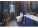 Elegant powder room with navy wallpaper, marble vanity, and gold accents at 3489 Knollwood Nw Dr, Atlanta, GA 30305