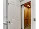 Convenient residential elevator features a wood paneled interior and modern lighting at 3707 Peachtree Ne Rd # 8, Atlanta, GA 30319