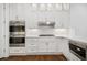 Stylish kitchen boasts stainless steel appliances, white cabinets, and sleek countertops at 3707 Peachtree Ne Rd # 8, Atlanta, GA 30319