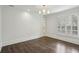 Spacious living room with hardwood floors and modern lighting at 3707 Peachtree Ne Rd # 8, Atlanta, GA 30319