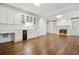 Living room features hardwood floors, built-in cabinets, and a modern wet bar with a wine fridge at 3707 Peachtree Ne Rd # 8, Atlanta, GA 30319