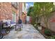 Inviting backyard patio with stone tile, comfortable seating, and privacy fence at 3707 Peachtree Ne Rd # 8, Atlanta, GA 30319