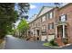 Charming brick townhomes feature front-entry garages, landscaped yards, and classic architectural details at 3707 Peachtree Ne Rd # 8, Atlanta, GA 30319
