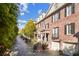 Beautiful brick townhomes with black shutters, manicured landscaping, and attached garages on a tree-lined street at 3707 Peachtree Ne Rd # 8, Atlanta, GA 30319