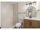 Stylish bathroom with a tiled shower, modern vanity, and updated fixtures at 6703 Cameron Rd, Morrow, GA 30260