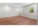 Spacious bedroom with hardwood flooring and two windows for natural light at 6703 Cameron Rd, Morrow, GA 30260