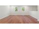 Spacious bedroom with hardwood flooring and two windows for natural light at 6703 Cameron Rd, Morrow, GA 30260