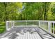 Wood deck surrounded by lush greenery at 6703 Cameron Rd, Morrow, GA 30260