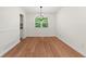 Bright dining room with a modern chandelier and hardwood floors at 6703 Cameron Rd, Morrow, GA 30260
