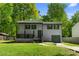 Charming two-story home featuring a covered front porch and well-maintained lawn and driveway at 6703 Cameron Rd, Morrow, GA 30260