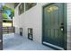 Exterior view of the home with a green front door and siding at 6703 Cameron Rd, Morrow, GA 30260