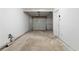 Spacious garage with a gray door and concrete flooring at 6703 Cameron Rd, Morrow, GA 30260