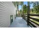 Exterior side porch with decorative columns and green railing at 6703 Cameron Rd, Morrow, GA 30260