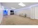 Spacious carpeted basement with recessed lighting and entertainment area with a couch at 840 Whitby Dr, Douglasville, GA 30134