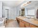Bathroom featuring tile floors, double sink vanity, garden tub, and separate shower at 840 Whitby Dr, Douglasville, GA 30134