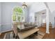 Airy dining room showcases a dark wood table with seating for six and a large window at 840 Whitby Dr, Douglasville, GA 30134
