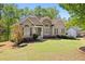 Inviting home with fresh landscaping and a combination of stone and siding exterior at 840 Whitby Dr, Douglasville, GA 30134