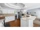 Updated kitchen featuring white cabinets, stainless steel appliances, and a breakfast bar at 840 Whitby Dr, Douglasville, GA 30134