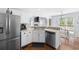 Eat-in kitchen featuring stainless steel appliances, updated cabinetry, and breakfast nook with backyard views at 840 Whitby Dr, Douglasville, GA 30134