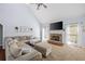 Spacious living room boasts a stone fireplace, plush seating, and abundant natural light at 840 Whitby Dr, Douglasville, GA 30134