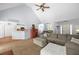 Spacious living room with vaulted ceiling and views into the kitchen and dining area at 840 Whitby Dr, Douglasville, GA 30134