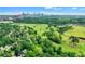Expansive aerial view features lush greenery, a golf course, and the city skyline in the distance at 2562 Red Valley Rd, Atlanta, GA 30305
