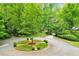 Aerial view of the home showing the circular driveway, mature trees, and landscaping at 2562 Red Valley Rd, Atlanta, GA 30305