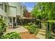 Charming backyard featuring brick patio, well manicured yard, and lush landscaping at 2562 Red Valley Rd, Atlanta, GA 30305