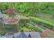 Lush backyard featuring a water fountain, brick patio, and mature greenery at 2562 Red Valley Rd, Atlanta, GA 30305