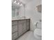 Stylish bathroom featuring a marble countertop vanity, mosaic tile flooring, and a large mirror at 2562 Red Valley Rd, Atlanta, GA 30305