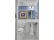 Bathroom featuring pedestal sink, wainscoting and black and white tiled floor at 2562 Red Valley Rd, Atlanta, GA 30305