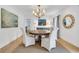 Elegant dining room featuring a round table, stylish chairs, and ample natural light at 2562 Red Valley Rd, Atlanta, GA 30305