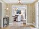 Inviting entryway leading to the dining area with elegant chandelier and stylish decor at 2562 Red Valley Rd, Atlanta, GA 30305