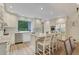 Bright eat-in kitchen features an island, stainless steel appliances, and a view of the backyard at 2562 Red Valley Rd, Atlanta, GA 30305