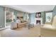 Inviting living room featuring a cozy fireplace, elegant furnishings, and natural light at 2562 Red Valley Rd, Atlanta, GA 30305