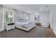 Serene main bedroom with neutral tones, natural light, and a comfortable seating area at 2562 Red Valley Rd, Atlanta, GA 30305