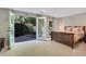 Bright main bedroom with patio access, carpet floors, and neutral walls at 2562 Red Valley Rd, Atlanta, GA 30305