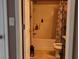 Modest bathroom with tub, shower, and cabinet at 4175 Round Stone Dr, Snellville, GA 30039
