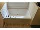 Clean and inviting bathtub with tile surround offering a serene space for relaxation at 4175 Round Stone Dr, Snellville, GA 30039